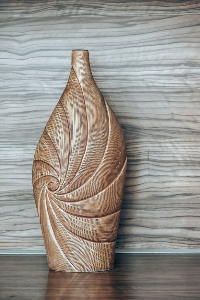 Elegant wooden vase with spiral design, perfect for home decoration and adding rustic charm.